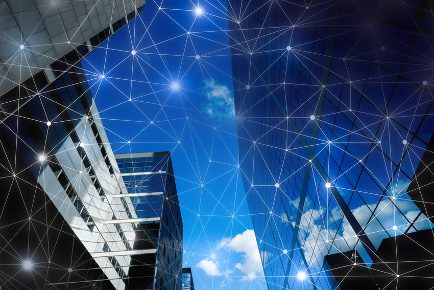 View of city buildings with a grid graphic layered on top.